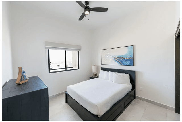 Ventanas Centro bedroom with large bed and window