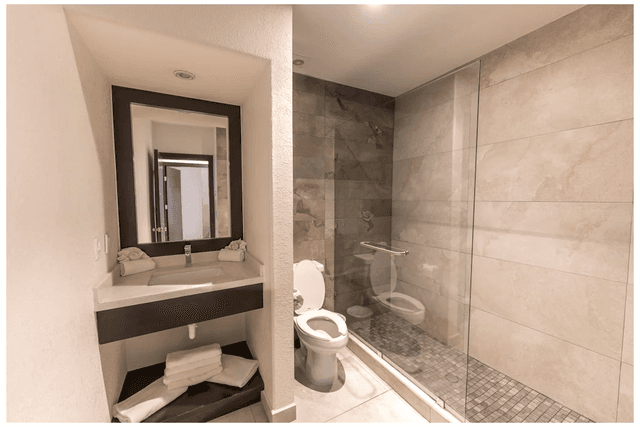 Villa Playa bathroom with double sinks and walk-in shower