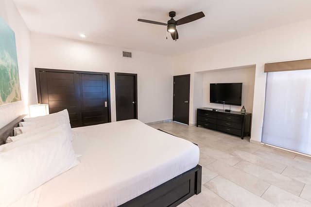 Villa Playa bedroom with king bed and balcony access