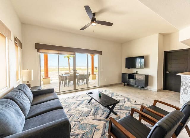 Villa Playa living room with large windows and ocean view