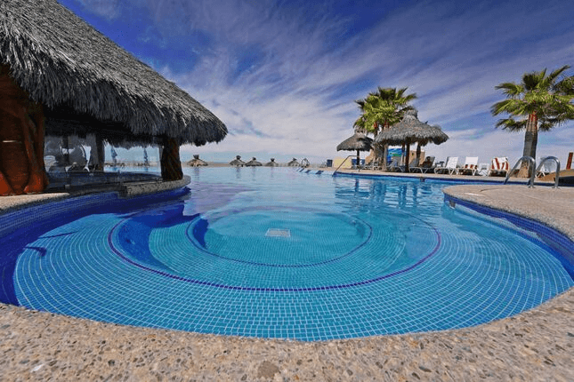 Infinity pool with swim-up bar at Laguna Shores Resort